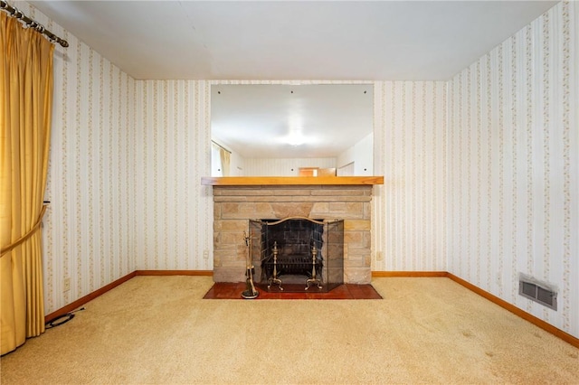 unfurnished living room with a fireplace and carpet