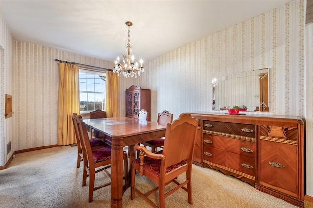 carpeted dining room featuring a notable chandelier