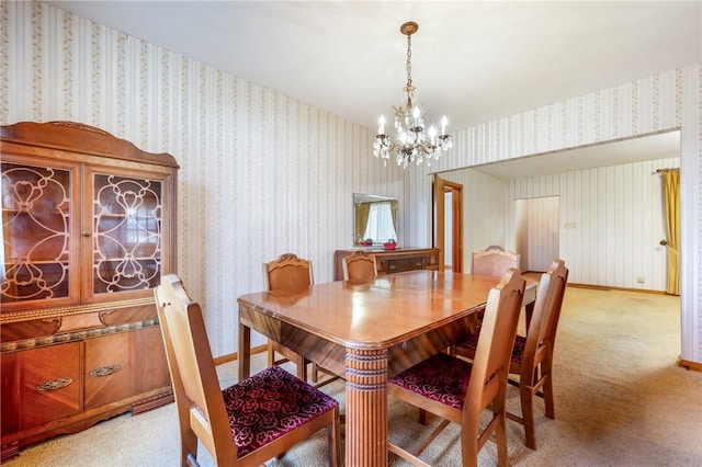 carpeted dining room with a chandelier