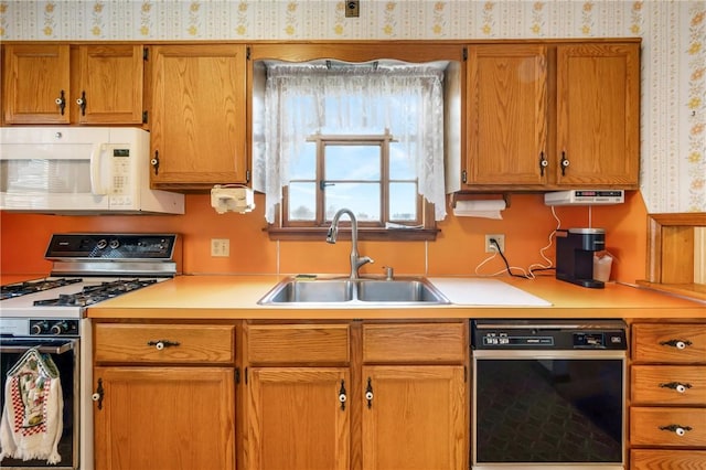 kitchen with white appliances and sink