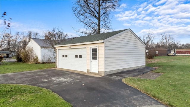 garage with a yard