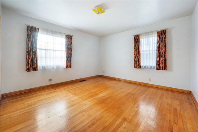 unfurnished room featuring light hardwood / wood-style flooring