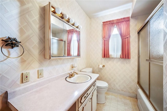 full bathroom with vanity, toilet, and enclosed tub / shower combo