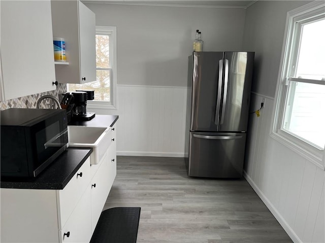 2306 Audley Ave, New Castle/2Nd, PA 16105 - kitchen with stainless steel refrigerator, a wealth of natural light, and white cabinets