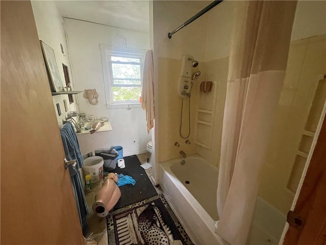 bathroom with shower / bath combination with curtain and toilet