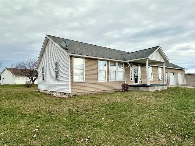 view of front of property featuring a garage and a front yard