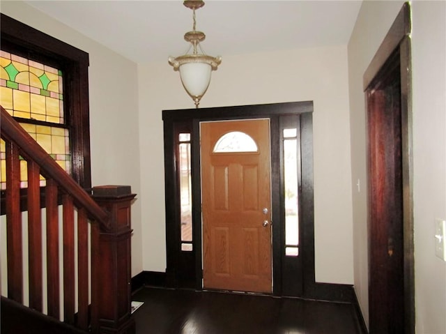 entrance foyer featuring dark hardwood / wood-style floors