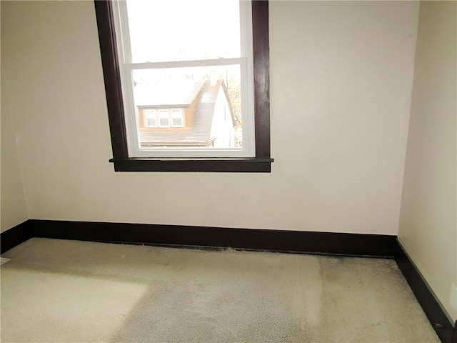 unfurnished room featuring carpet flooring