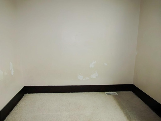 empty room with carpet flooring