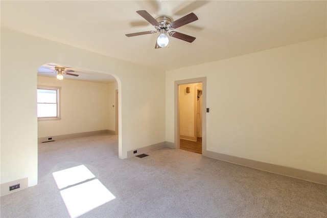 571 Kaylor Frogtown Rd, Bradys Bend Twp, PA 16025 - carpeted empty room with arched walkways and a ceiling fan