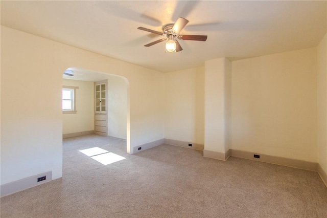 carpeted empty room with ceiling fan