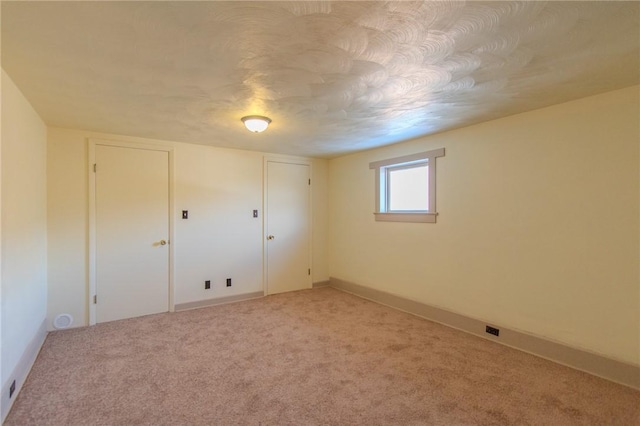 spare room featuring carpet floors