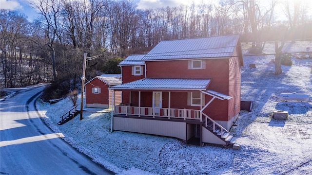 571 Kaylor Frogtown Rd, Bradys Bend Twp, PA 16025 - view of front of house featuring a porch, stairs, a metal roof, and view of wooded area