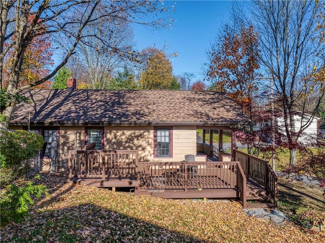 back of house featuring a deck