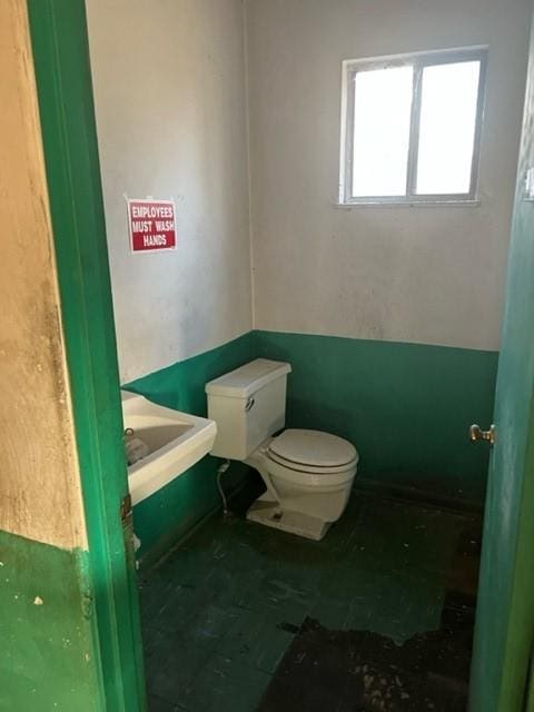 bathroom featuring toilet