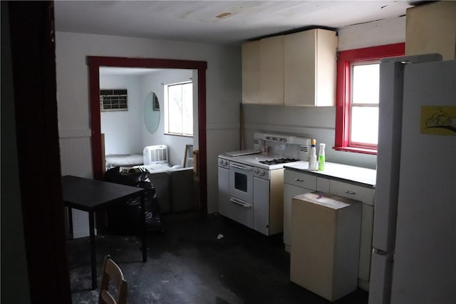 kitchen featuring white appliances and an AC wall unit