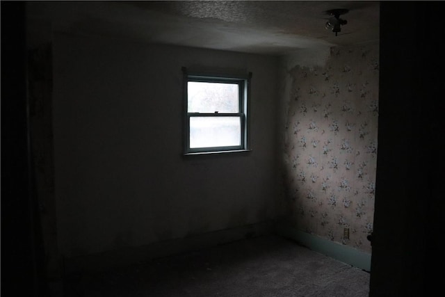 spare room featuring a textured ceiling