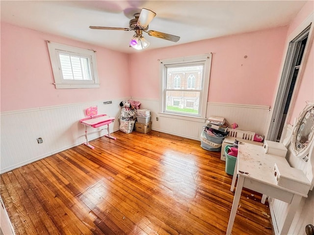 playroom featuring ceiling fan and light hardwood / wood-style flooring