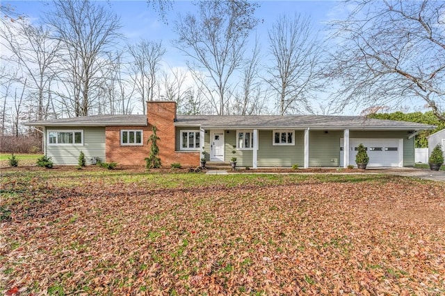 ranch-style home featuring a garage