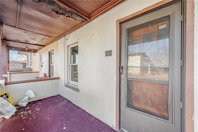 doorway to property with a porch