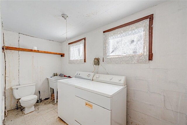 laundry area with independent washer and dryer