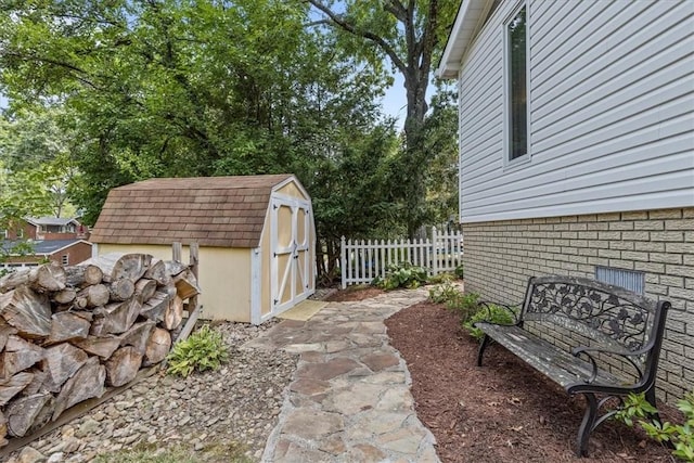 view of patio featuring a shed