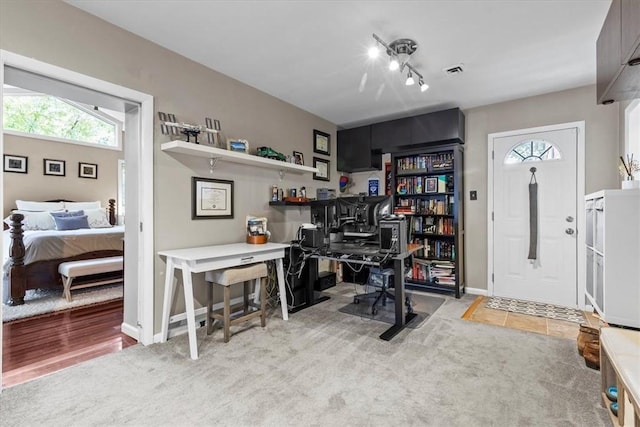 home office featuring light colored carpet