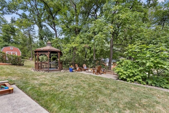 view of yard with a gazebo and an outdoor fire pit