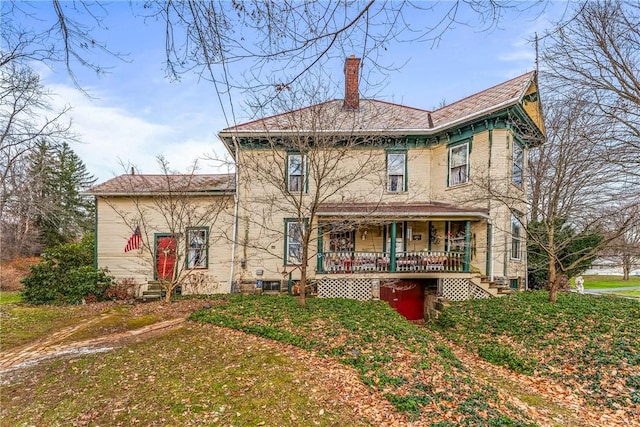 rear view of house with a porch