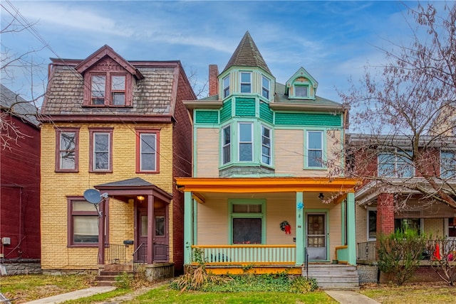 victorian house featuring a porch