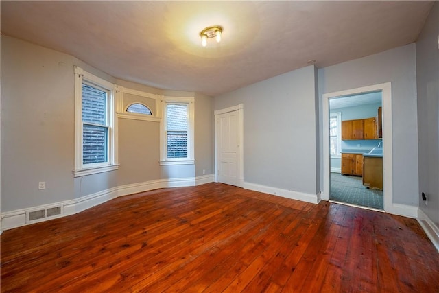 spare room featuring hardwood / wood-style flooring