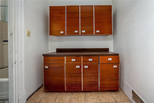 kitchen with light tile patterned floors