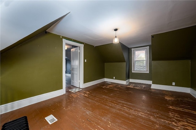 bonus room featuring dark hardwood / wood-style floors and lofted ceiling