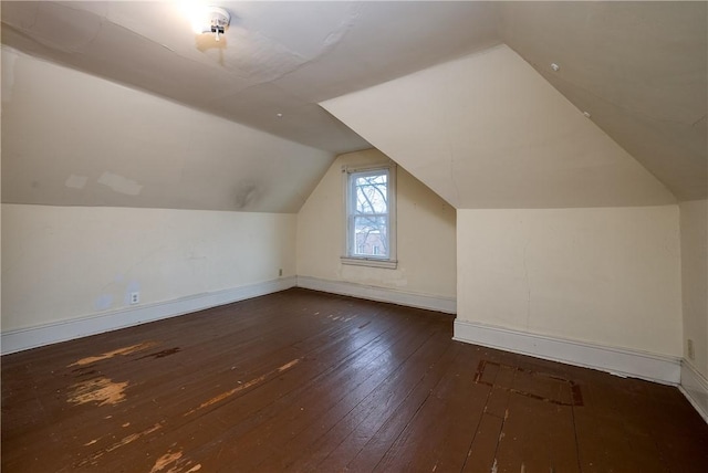 bonus room featuring dark hardwood / wood-style floors and lofted ceiling