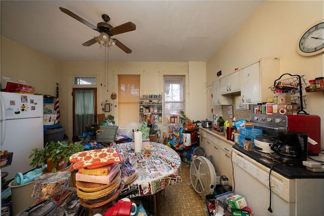 kitchen featuring white cabinetry, white fridge, and ceiling fan