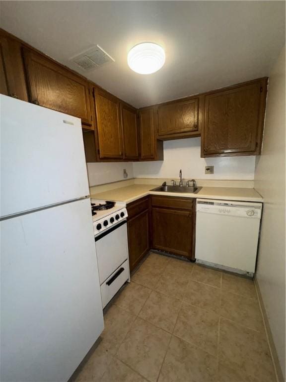 kitchen with sink and white appliances