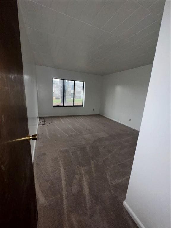 unfurnished room featuring carpet flooring