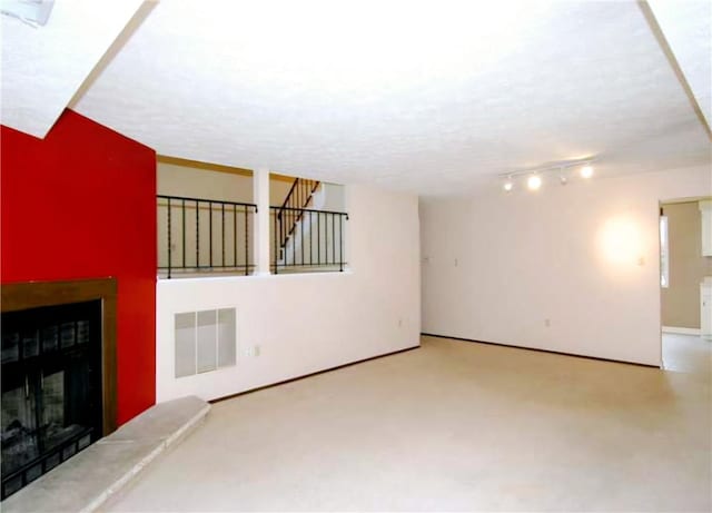 unfurnished living room with a textured ceiling