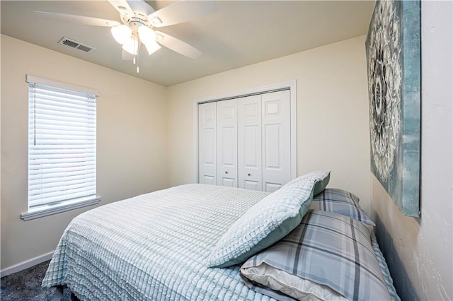 bedroom with carpet flooring, a closet, and ceiling fan