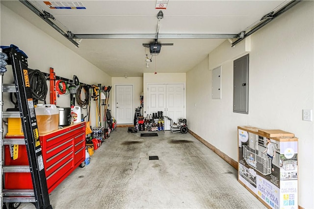 garage with a garage door opener and electric panel