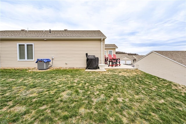 rear view of property featuring a patio area and a yard