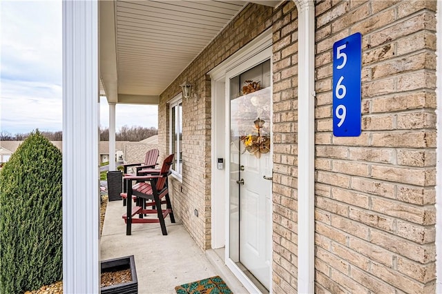 property entrance featuring covered porch