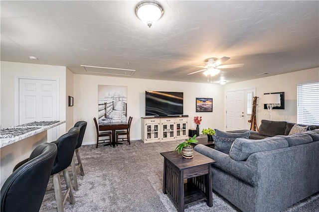 living room featuring carpet flooring and ceiling fan