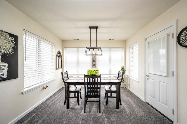 dining space with dark carpet