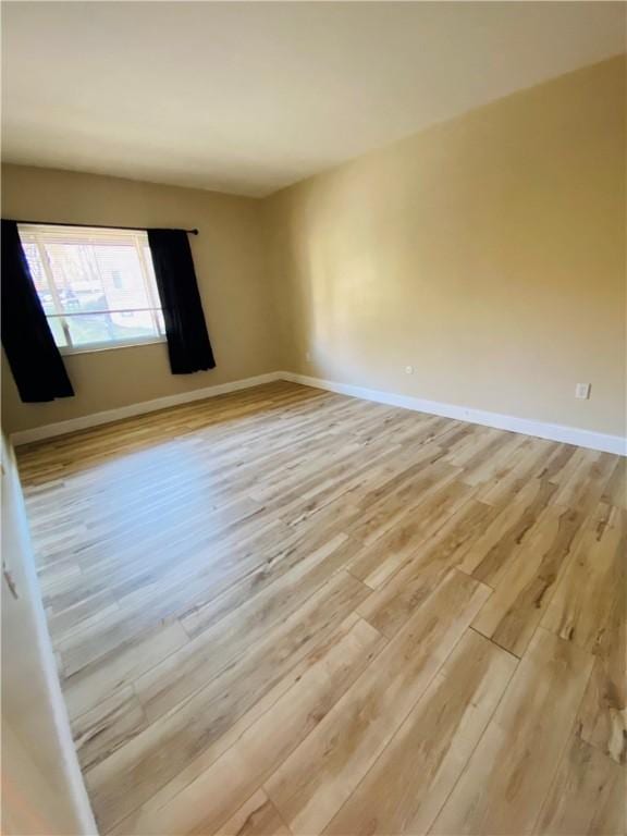 empty room with light wood-type flooring