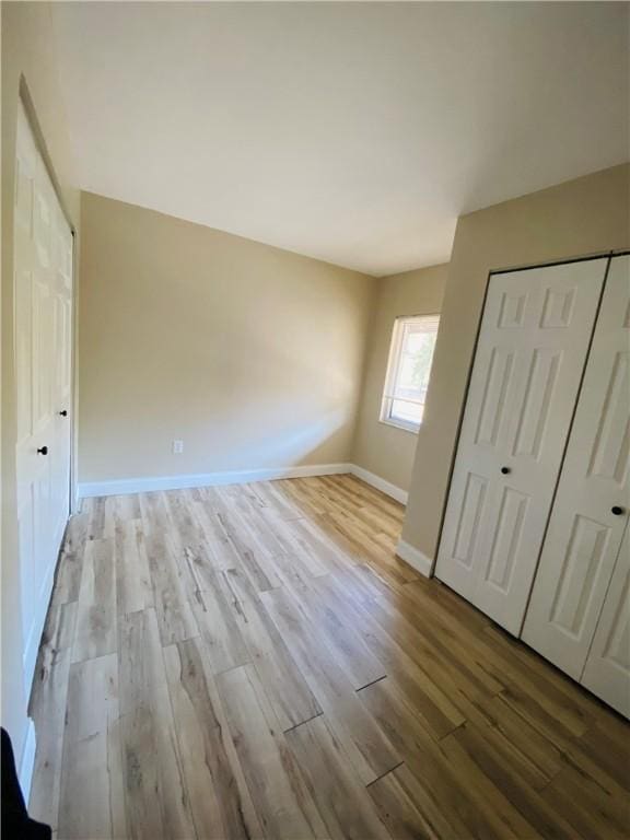 unfurnished bedroom featuring light hardwood / wood-style floors