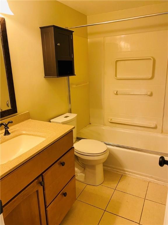 full bathroom featuring tile patterned flooring, vanity, toilet, and shower / bath combination