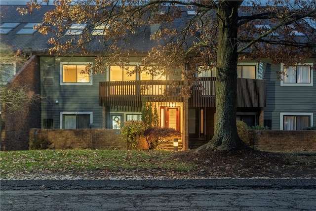 view of front of home with a balcony