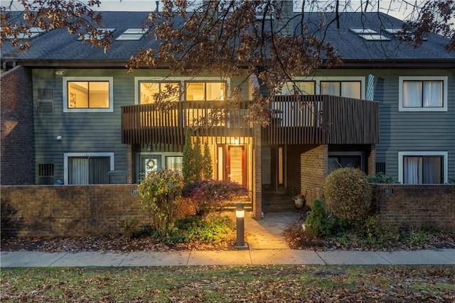 view of front of home with a balcony