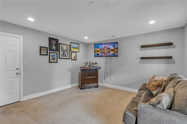 living area featuring carpet floors